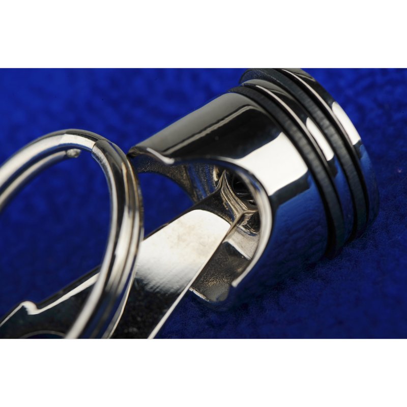 Brelok metalowy Piston, srebrny z nadrukiem logo f