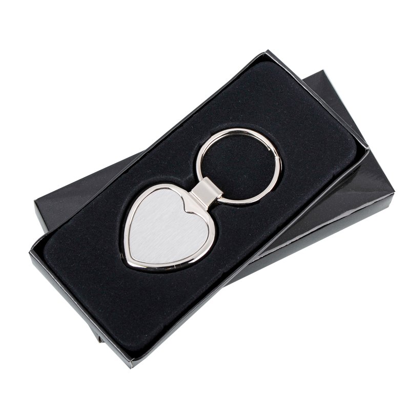 Brelok metalowy Stout Heart, srebrny z grawerem logo a